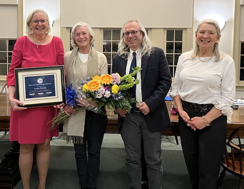 Board of Selectmen flanks honoree