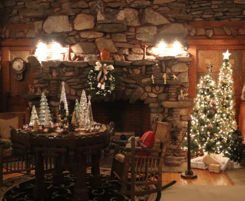 The great room of Gillette Castle is decorated for the holidays with trees, wreaths and lights.