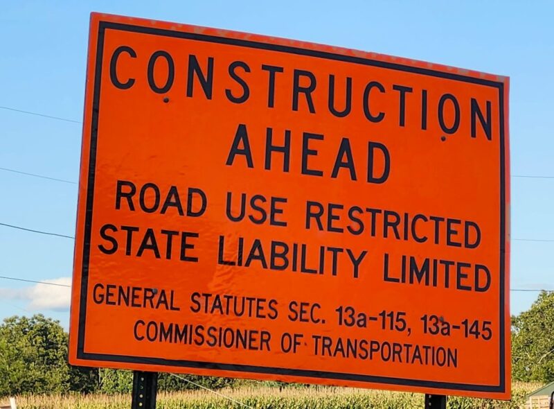 An orange "Construction Ahead" sign
